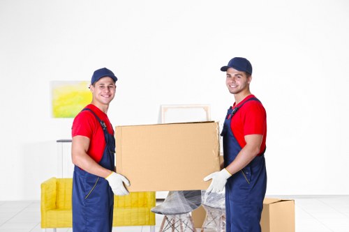 Professional team packing office equipment for relocation